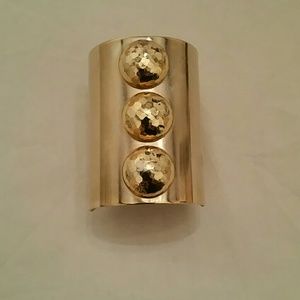 Gold tone metal bracelet cuff